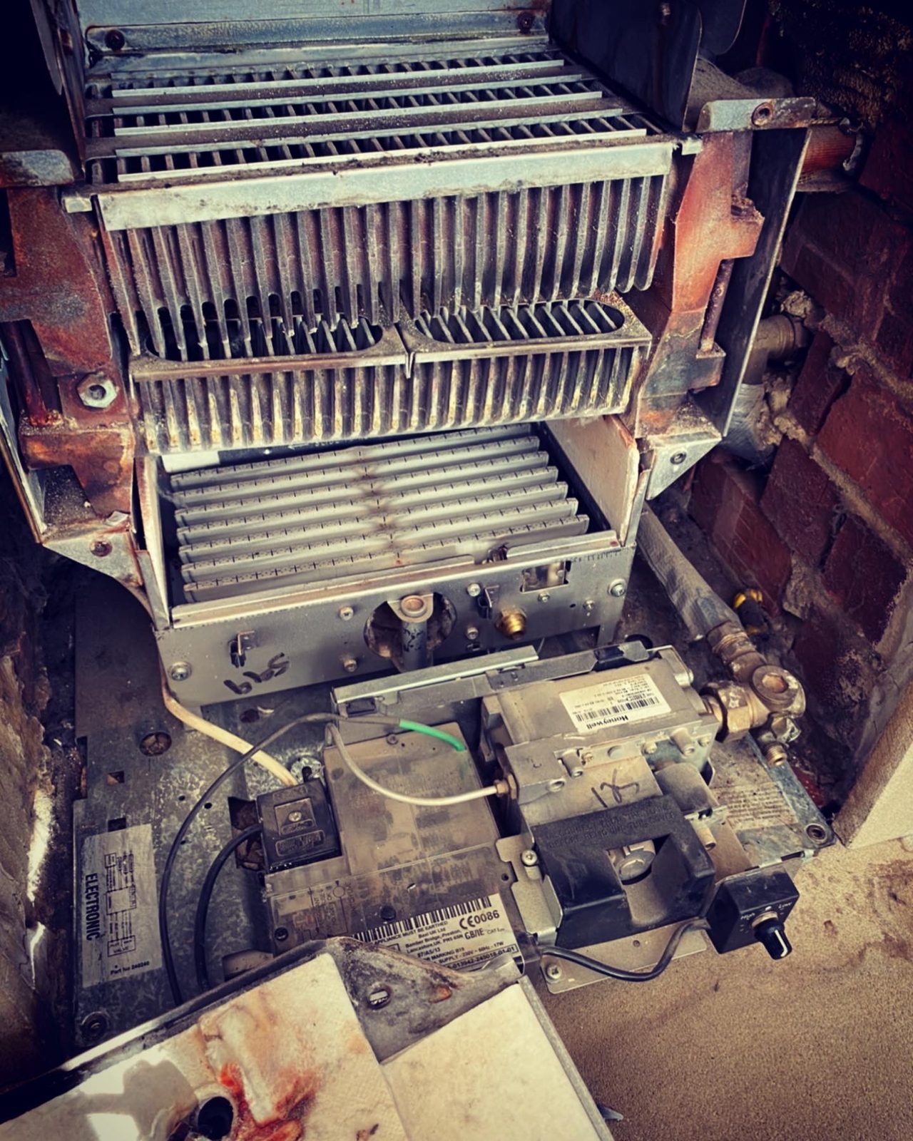 An old boiler stripped down with the heat exchanger exposed